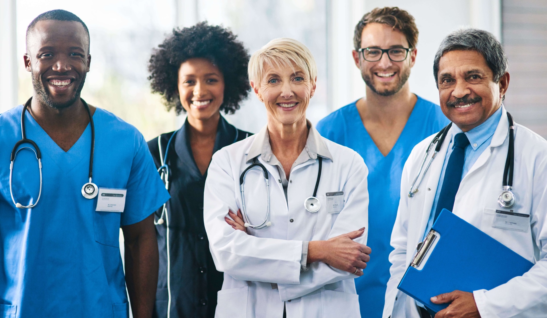 a group of doctors standing together in a hospital