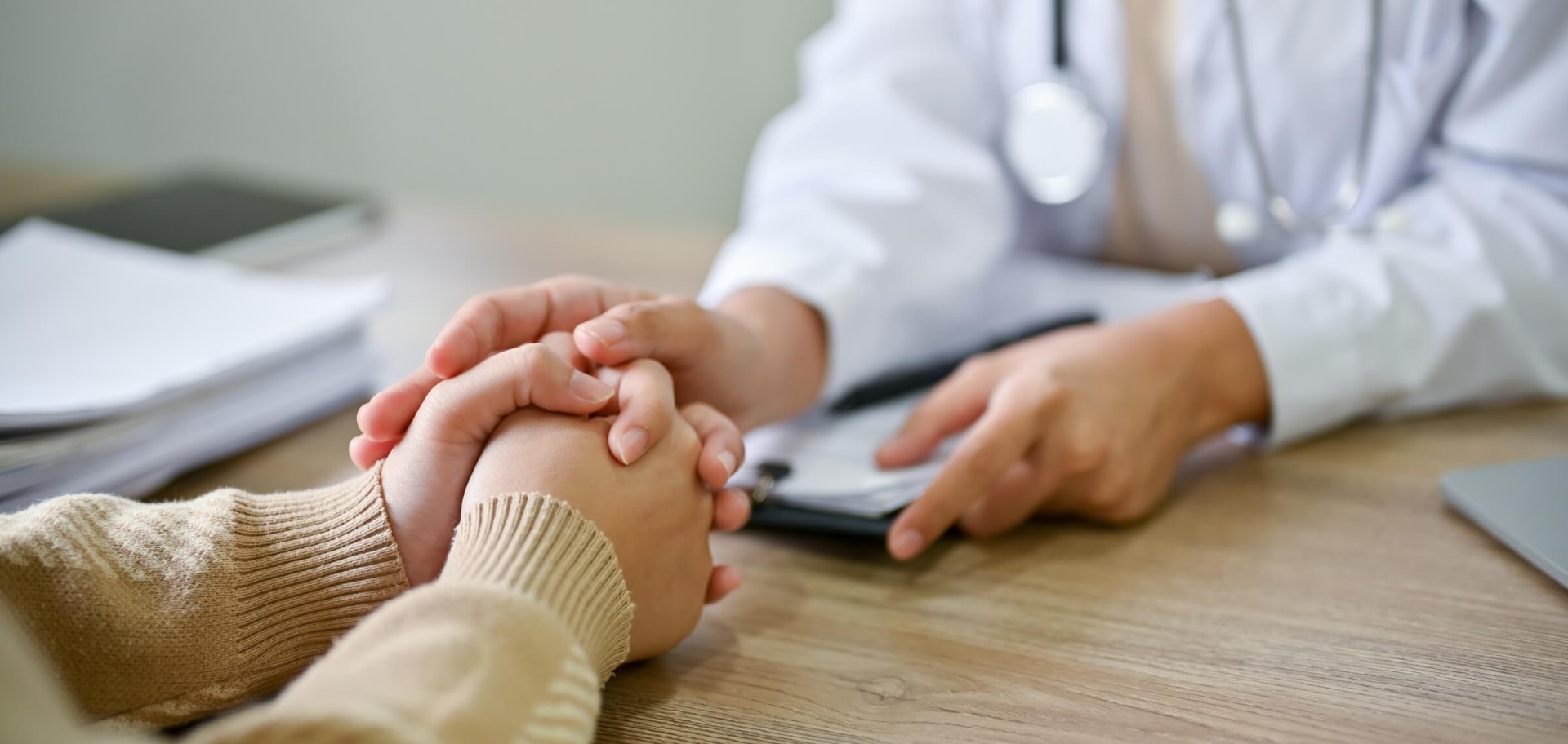 a doctor holding a patient's hand