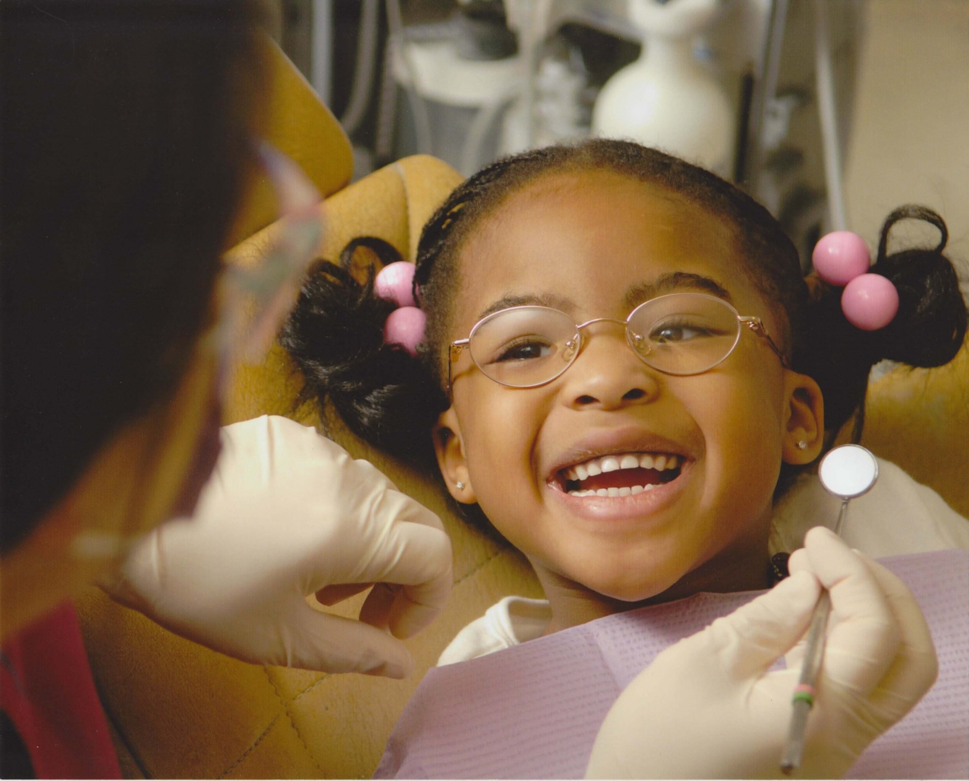 a child smiling at dentist